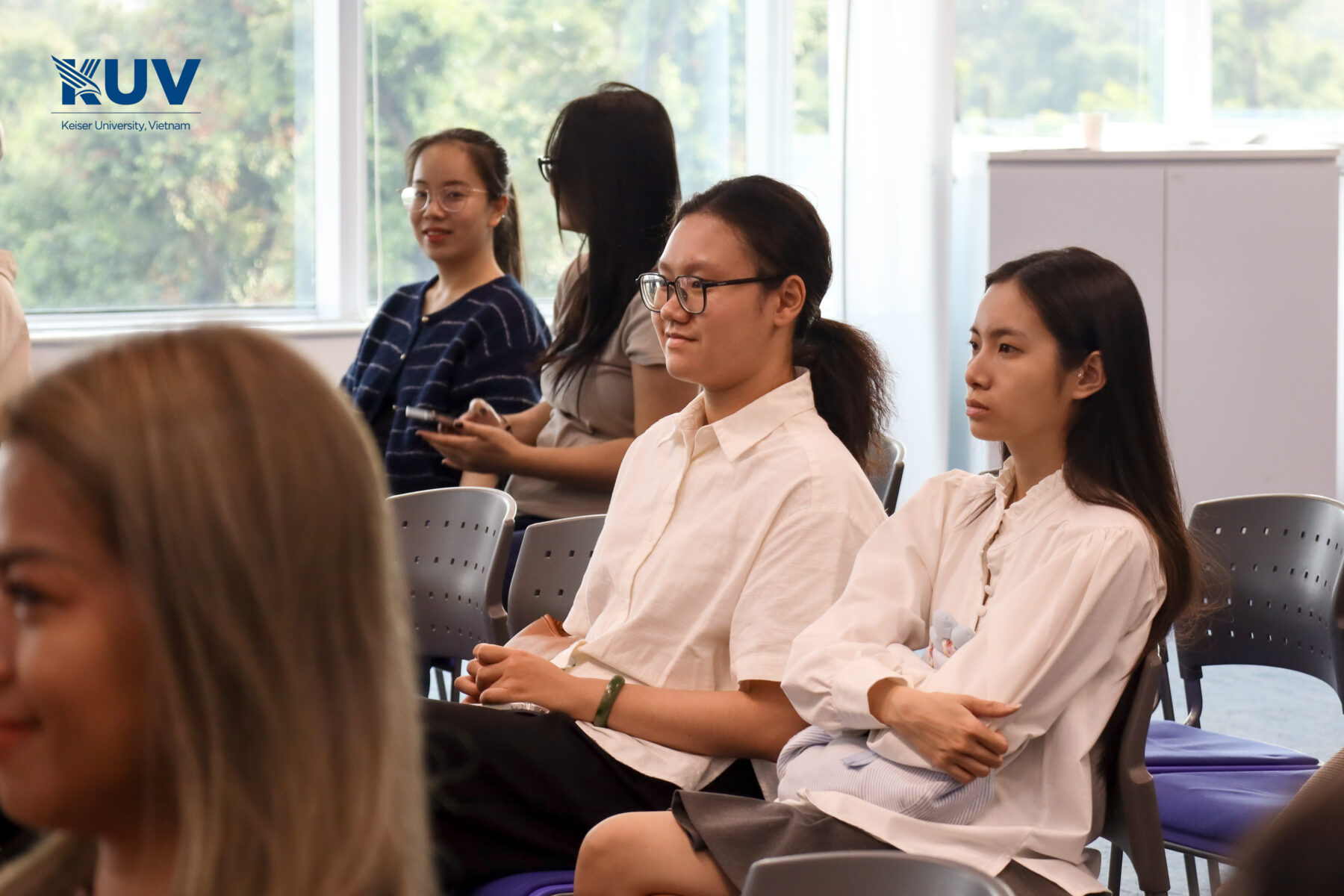 The audience learns about the value of studying in the US